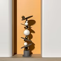Abstract Sculpture Carving Artwork With Layered Spheres And Metal Plates On Gray Base