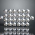 Silver Decorative Spheres Arranged in Matrix with Various Sizes and Textured Surfaces