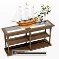 Wooden Coffee Table with Glass Top Featuring Sailing Ship Model and White Flower Vase