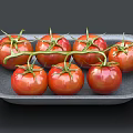 Ripe Red Tomatoes With Fresh Green Leaves On Gray Tray