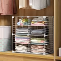 Clothes Neatly Stacked In Closet With Metal Grid Storage Rack And Various Colors