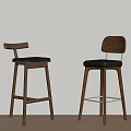 Two Modern Bar Stools With Wooden Frame And Black Seat Against Beige Wall On Wood Floor