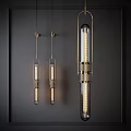 Modern Brass And Glass Tube Shaped Pendant Lights With Warm Illumination Against Dark Wall