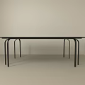 Minimalist Black Long Desk With Slim Legs In White Room And Light Floor