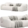Cozy Modern Sectional Sofa In Beige And Brown With Textured Fabric Pillows And Blanket