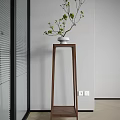 Tall Wooden Plant Stand With White Ceramic Pot And Green Plants In Modern Interior