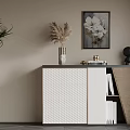 Elegant Entryway Console Cabinet with Woven Panel Vase Floral Art Black Sculpture and Books