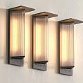 Three Modern Illuminated Wall Lamps With Metal Frame And Striped Lampshade Mounted On Light Wall