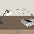 Modern Adjustable Arm Desk Lamps With White Shade On Wooden Desk And Books