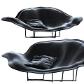 Two Black Irregular Shape Sofa With Unique Curved Design Gray Cushions And Sturdy Metal Legs