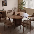 Round Wooden Dining Table With Woven Chairs And Cabinet In Cozy Room Interior