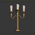 Decorative Golden Candelabra With Five White Candles And Ornate Base Design