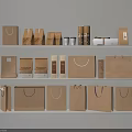 Various Paper Shopping Bags And Packaging Boxes On White Shelves For Daily Use