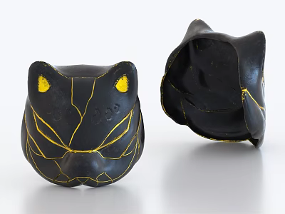 Black Cat Head Shaped Decorative Ornament With Yellow Lines And Crackled Design 3d model