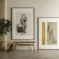 Textured Wall Interior With Framed Artworks Potted Plant And Wooden Stool