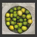 Fresh Limes and Lemons in Metal Colander Bowl on White Paper