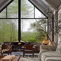 Serene Living Room Interior Design With Large Windows Green View Fireplace And Comfortable Seating