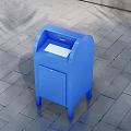 Blue Commercial Equipment With Mail Slot And Door On Paved Ground Against Gray Brick Wall