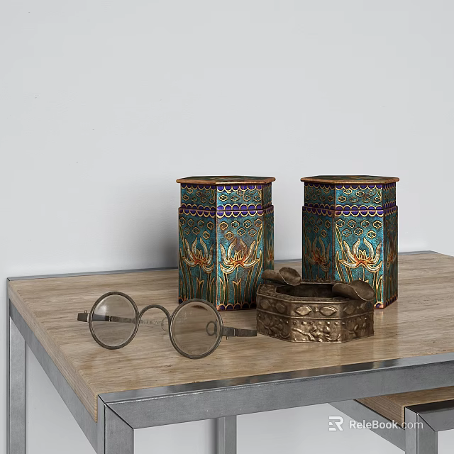 Decorative Ornament Set With Colorful Crane Pattern Jars Metal Box And Eyeglasses On Wooden Table 3d model 