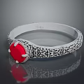Intricate Silver Bracelet With Black Decorative Patterns And Red Central Stone