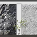 Textured Stone Background Wall With Dark And Light Patterns And Green Plant In White Planter