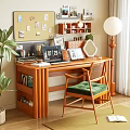 Wooden Study Desk with Laptop Photo Frames Corkboard Floor Lamp and Green Cushion Chair