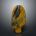 Oval Shaped Wooden Stone With Yellow Black White Natural Texture And Patterns