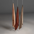 Three Hanging Fabric Textiles In Earthy Tones With Soft Texture And Minimalist Background