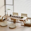 Modern Wooden Tea Table and Chairs with Round Cushions by Window Vase and Tea Set