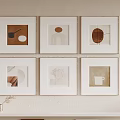Minimalist Decorative Paintings on Beige Wall with White Frames and Dried Flowers