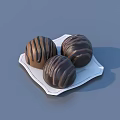 Delicious Chocolate Balls With Brown Stripes On White Plate For Sweet Dessert