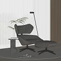Modern Leisure Chair with Ottoman Side Table Green Plant and Floor Lamp on Rug