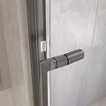 Modern Textured Stainless Steel Door Handle Mounted On Glass Door With Marble Wall Interior