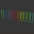Colorful Paper Clips Arranged In A Row With Shiny Reflections On Sleek Surface