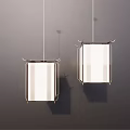 Two Modern Pendant Lights With Metal Frame And White Rectangular Shades Hanging In Contemporary Interior