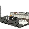 Stylish Beige Tufted Sofa Coffee Table Combination With Decorative Pillows And Geometric Rug
