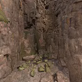 Natural Rocky Crevice Between Rugged Rock Walls With Green Moss And Scattered Stones
