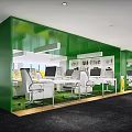 Modern Public Office Space Featuring Green Walls White Desks Chairs Computers And Pendant Lights
