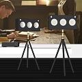 Black Speakers With Multiple Drivers On Tripods And Amplifier In Modern Room