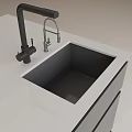 Modern Black Kitchen Sink in White Countertop with Black and Silver Faucets and Cabinet