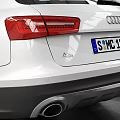 White Audi Avant Station Wagon In Indoor Garage With Tire Tracks On Floor