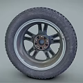 Car Tire With Black Tread Pattern And Silver Alloy Rim Design