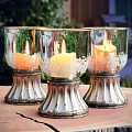 Candle Lamp with Transparent Glass Shade and Floral Patterns on Decorative Silver Base