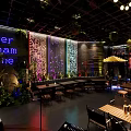 Modern Bar Interior With Green Plants Neon Signs And Cozy Seating