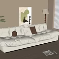 Beige Three Seater Sofa With Throw Pillows Floor Lamp Wall Art And Potted Plant