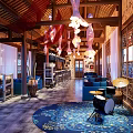 Cozy Café Interior With Wooden Structure Blue Sofas Bar Counter And Drum Decorations