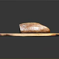 Fresh Crusty Bread Loaf on Wooden Cutting Board Surface