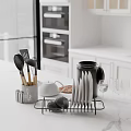 Modern Kitchen Interior With White Countertop Black Utensil Holder And Silver Cutlery