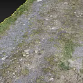 Unpaved Road Infrastructure With Gravel Surface Grass Edges And Scattered Stones