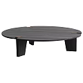 Round Dark Wood Coffee Table With Sturdy Angular Legs And Brass Accents